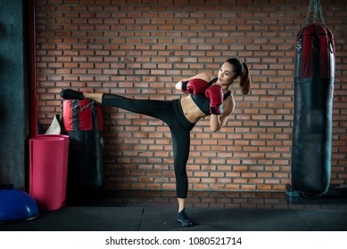 Asian Sport Woman Wear Boxing Glove Kick Boxer In The Gym,Thailand People Workout