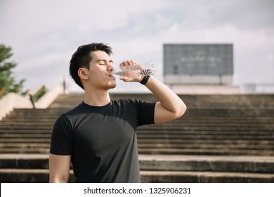 Asian Sportsman Drink Water