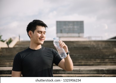 Asian Sportsman Drink Water