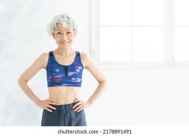 Asian Sporty Senior Woman In The Room