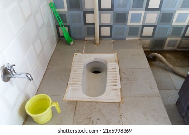 An Asian Squat Style Toilet And Bathroom In An Unhygienic Condition. India