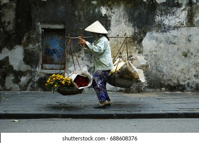 Asian Street Seller Flower In Hoi An Vietnam