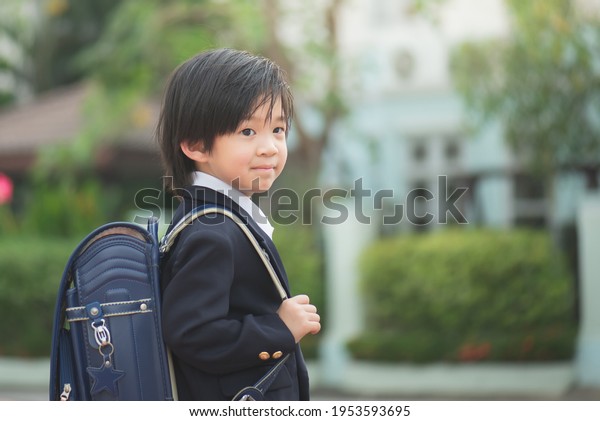 Asian student with backpack outdoors,back to\
school concept