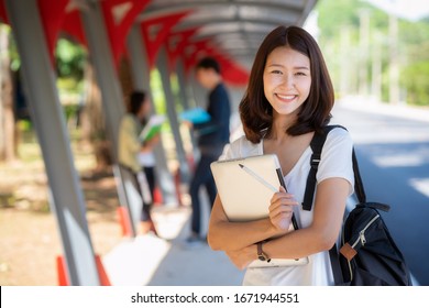 Asian Student Girl Stand With Group Of Happy Teen High School Students Outdoors