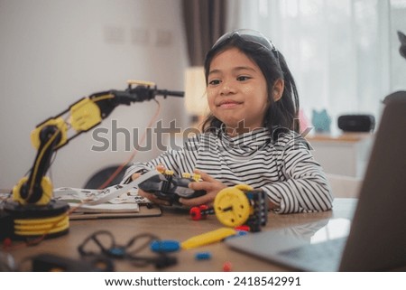 Asian students enjoy Machine Learning Robot arms Control robots in technology class, stem education robot arms for digital automation software for artificial intelligence AI. STEM education concept.