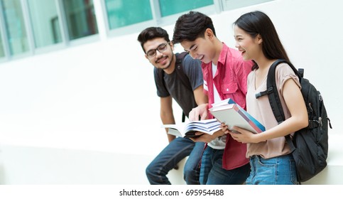 Asian Students Group Are Reading Books. At The University Library