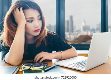 Asian Stylish Woman Designer Wear Black Dress And Red Lips Stressed Out Of Work In Selective Focus.
