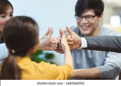 asian successful business people teamwork hand showing thumbs up, business concept.