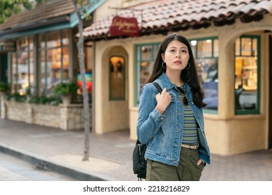 Asian Taiwanese Girl Tourist Traveling Alone In Carmel By The Sea. She Walks Around The Charming Town And Feeling Curious About Every Shops Along The Street