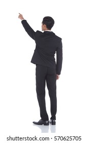 Asian Tan Skin Business Man in Black Suit Jacket Pants Shoe, white shirt, Turn Back View look up sky and point finger hand overthere, studio lighting white background isolated