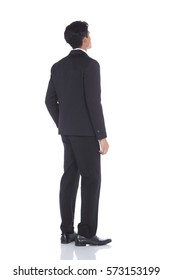 Asian Tan Skin Business Man In Black Suit Jacket Pants Shoe, White Shirt, Turn Back View Look Up Sky Overthere, Studio Lighting White Background Isolated