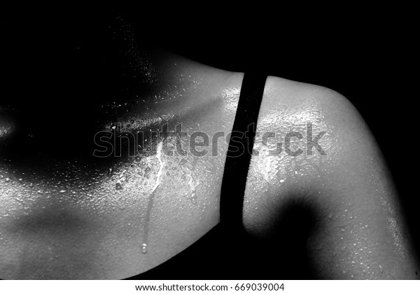 Asian Tan Skin Sport\
Girl in Fitness Bra long black pants, exercise sweat water drop in\
low key exposure lighting. black white concept no retouch, shoulder\
part, woman can do