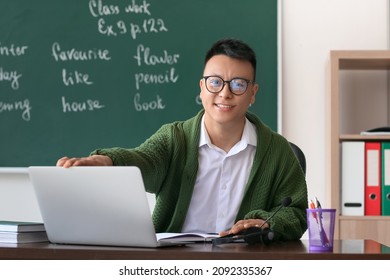 Asian teacher conducting English lesson online