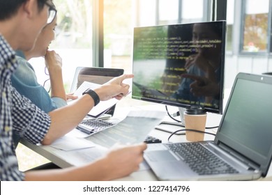 Asian Team Outsource Developer Looking Screen Programming Code Working With Laptop Computer Software 