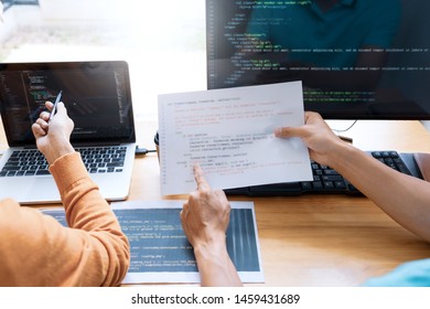 Asian team Outsource Developer Looking Screen Programming Code Working with Laptop Computer Software