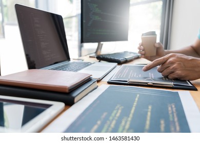Asian team Outsource Developer Looking Screen Programming Code Working with Laptop Computer Software