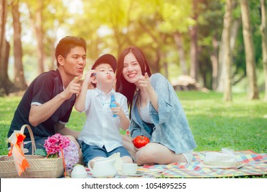 Asian Teen Family Happy Holiday Picnic Moment In The Park