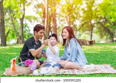 Asian Teen Family One Kid Happy Holiday Picnic Moment In The Park