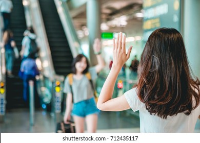 Asian Teen Women Greet Her Friends When Her Arrival At The Airport.