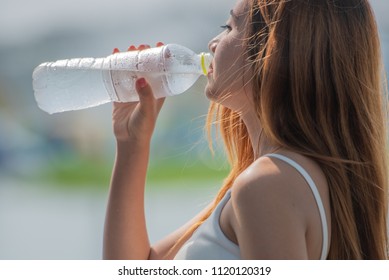 Asian Teenage Girl With Bottle Of Drinking Water, Healthy, Fresh, Clean, Pure Water Concept.