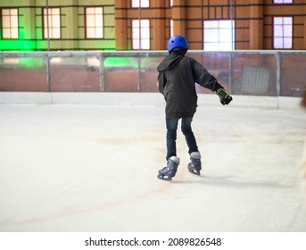 Asian Teenager Boy Play Ice Skate Indoor