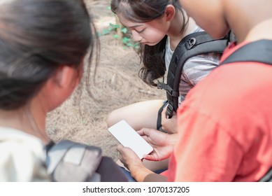 Asian Teenager Group With Backpack Looking Smartphone Have Phone Navigation To Travel In Nature,Freedom Life Concept