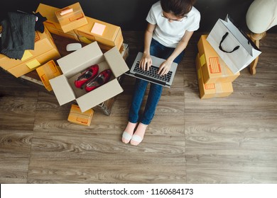 Asian teenager owner business woman work at home for online shopping and sale.