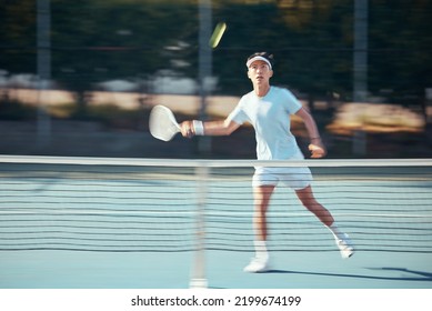 Asian Tennis Professional Training With A Racket And Playing A Game On Court. Fit Athlete Running During A Match And Play Competitive Sport Workout For Fitness And Health Alone In A Sports Club