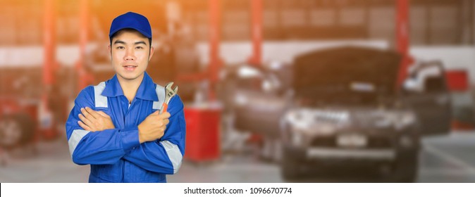 Asian Thai Technician Repairing The Car In Garage,mechanics Fixing In A Workshop Suspension Detail Of Lifted Automobile At Service Station,vintage Color.banner For Website.