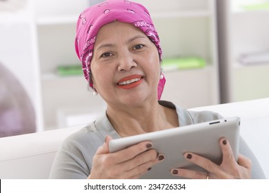 Asian Thai woman with digital tablet - Powered by Shutterstock