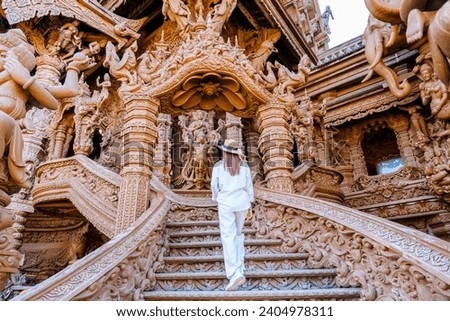 Asian Thai women visit The Sanctuary of Truth wooden temple in Pattaya Thailand