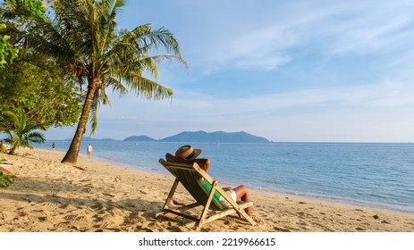Asian Thai women watching the sunset on a beach chair at Klong Kloi Beach Koh Chang Thailand.  - Shutterstock ID 2219966615