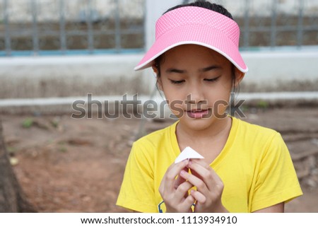 Asian Thailand Kids cute little girl Put on a Pink hat