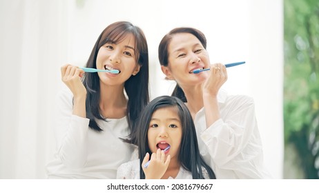 Asian Three Generation Female Family Brushing Their Teeth. Dental Care. Oral Care.