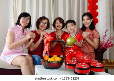Asian Three Generations Family Celebrate Chinese New Year.Chinese Characters In The Photo Means 