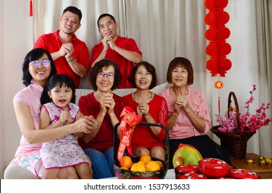 Asian Three Generations Family Celebrate Chinese New Year.Chinese Characters In The Photo Means 