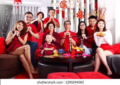 Asian Three Generations Family Celebrating Chinese New Year. Chinese Characters In The Photo Means 