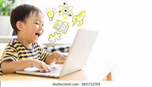 Asian Toddler Boy Student Online Learning Class Study Online Video Call Zoom Teacher, Happy Boy Learn Science Online With Laptop At Home.New Normal.Covid-19 Coronavirus.Social Distancing.stay Home.