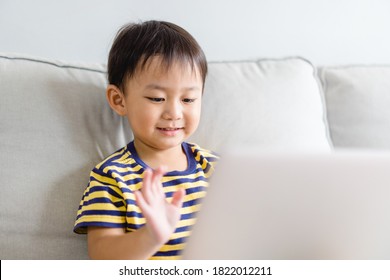 Asian Toddler Boy Student Online Learning Class Study Online Video Call Zoom Teacher, Happy Boy Learn Science Online With Laptop At Home.New Normal.Covid-19 Coronavirus.Social Distancing.stay Home.