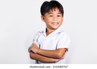 Asian Toddler Smile Happy Wearing Student Thai Uniform Red Pants Stand With Arms Folded In Studio Shot Isolated On White Background, Portrait Little Children Boy Preschool Crossed Arms, Back To School