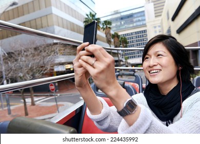 Asian Tourist Chinese Woman Having Fun On Open Top Bus In City Tour