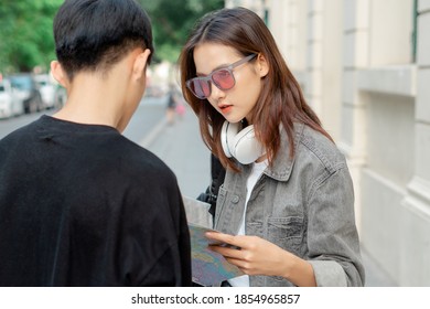 Asian Tourist Woman Is Asking For Directions
