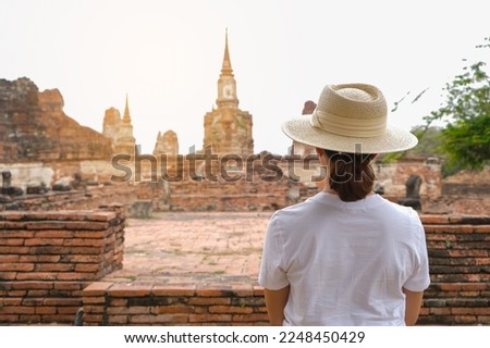 Asian tourists walking the ancient Thai temples, Thai national culture at Ayutthaya Province of Thailand travel concept