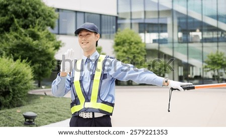 Asian traffic controller directing traffic