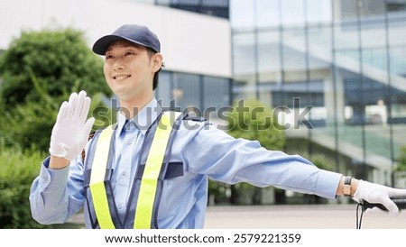 Asian traffic controller directing traffic