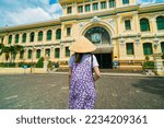 A asian traveler wearing conical hat (