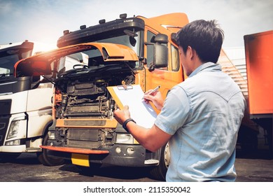 Asian Truck Driver Is Checking The Truck's Engine Maintenance Checklist. Mechanic Repairman Auto Service Shop. Lorry Driver. Inspection Truck Safety Driving. Shipping Cargo Freight Truck Transport.