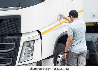 Asian Truck Driver Is Ready To Drive A Semi Truck