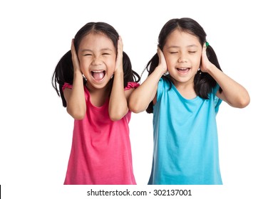 Asian Twins Girls Cover Their Ears  Isolated On White Background