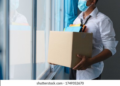 Asian unemployed person holds the document box by the window in hope, Unemployment in the Covid Virus Crisis 19. Business Failure Crisis was laid off from unemployment. 